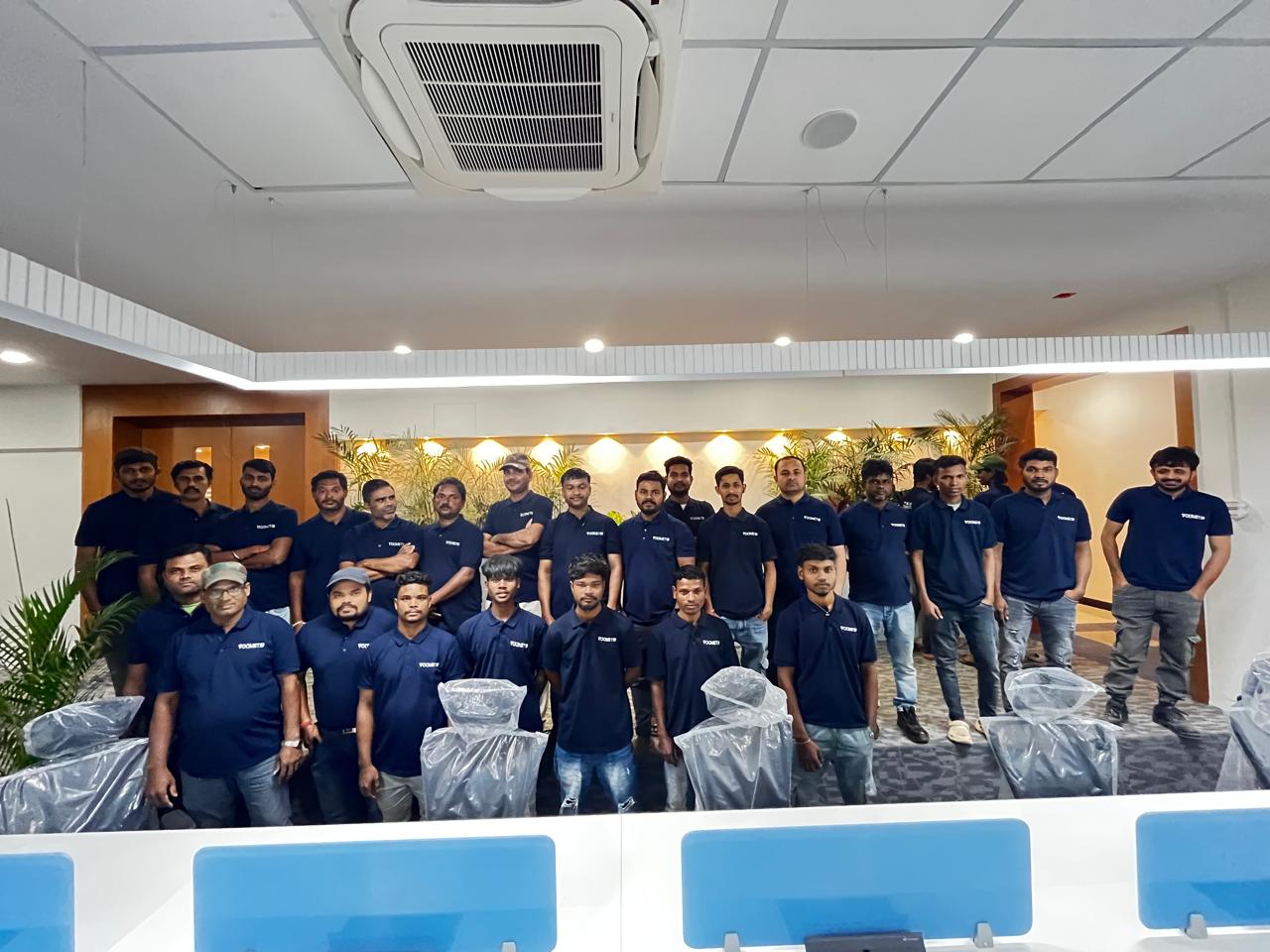 Voomet team standing together in the completed office space